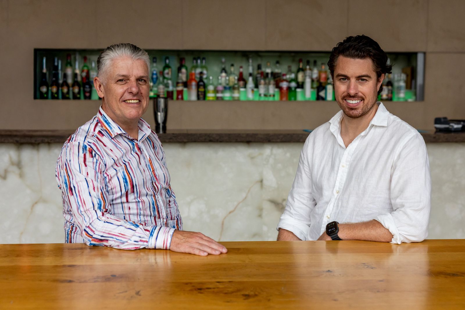 Gary Lennon and Matt Gubba, founders of bizbritain, sat together at a bar counter